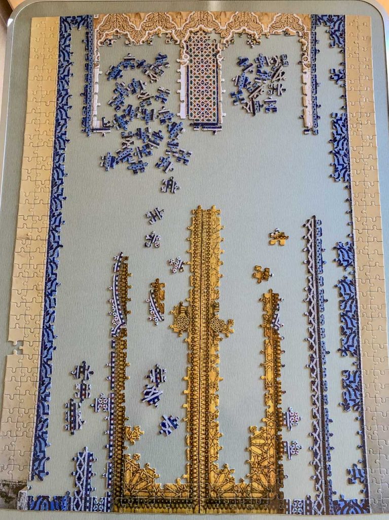 An unfinished jigsaw puzzle on a table