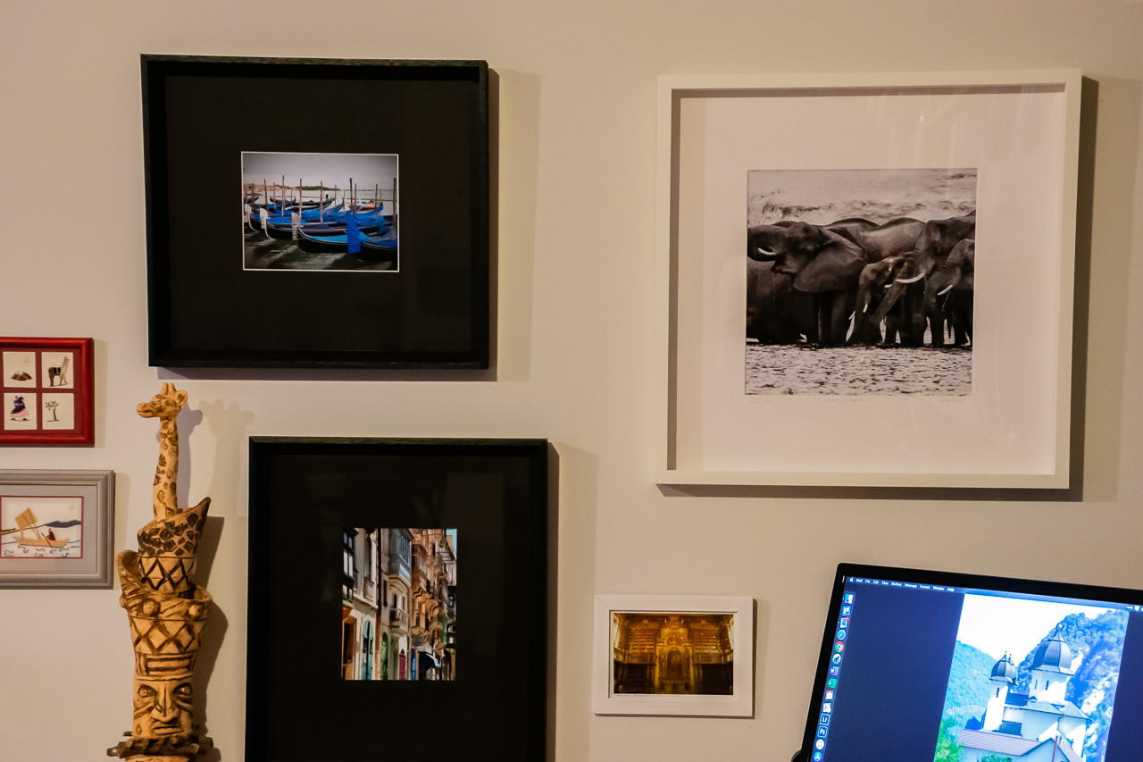 Framed photos hanging on a wall