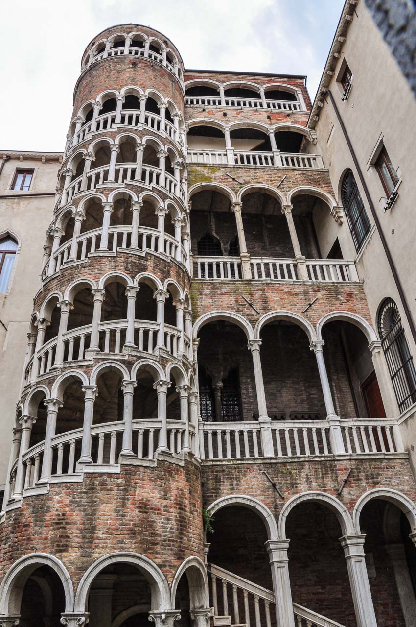 Multi-storied brick building with external spiral staircase