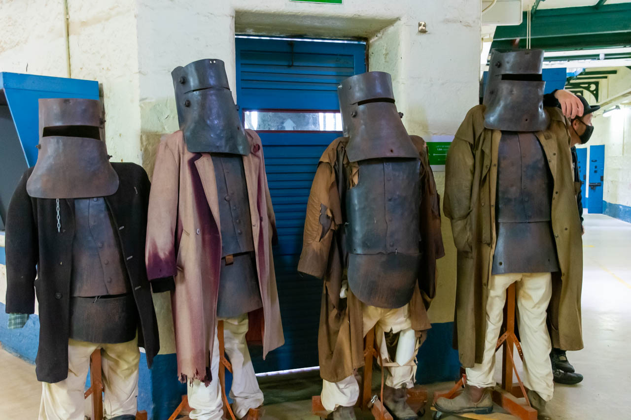 An image of four dummies wearing metal body armour and helmets