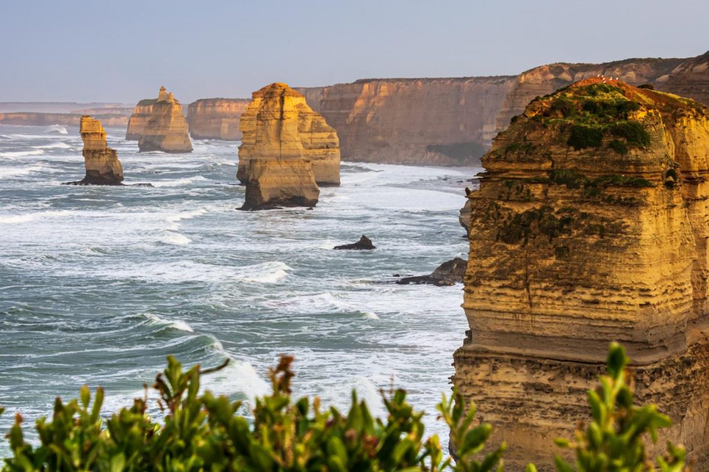 A photo of limestone stacks in the ocean along a coastline