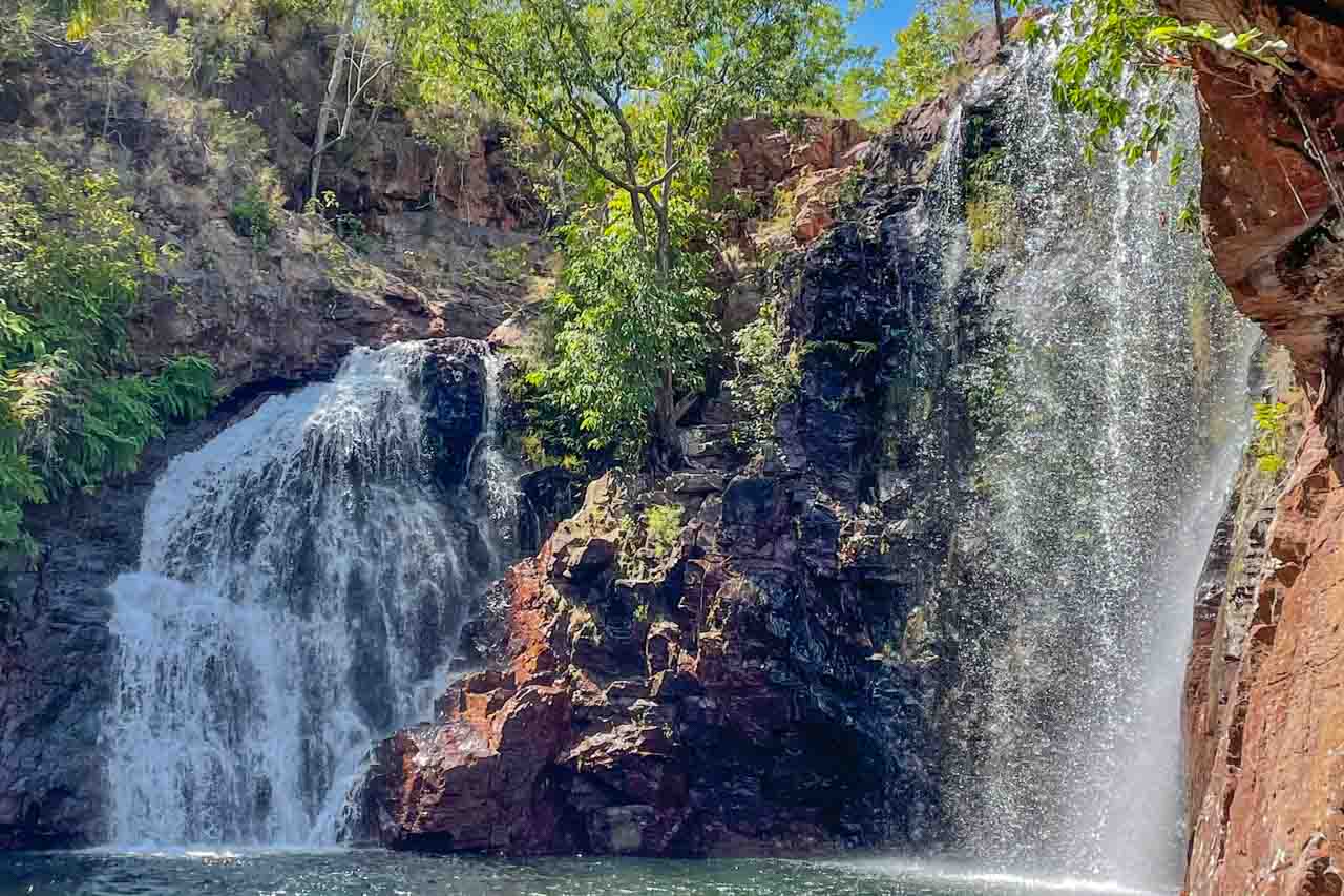 Florence Falls in Litchfield National Park. The waterfall with two streams plunges into the pool below.