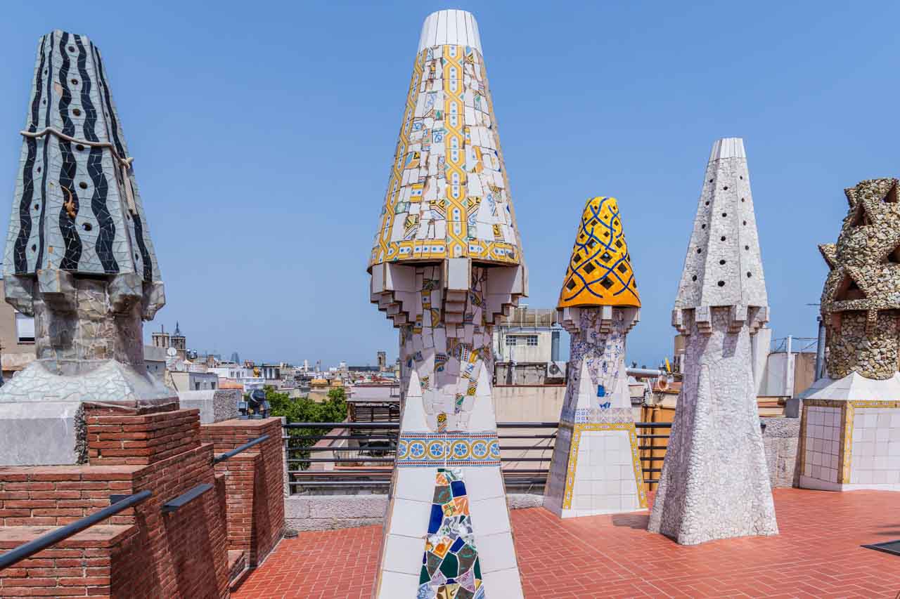 Cone-shaped chimneys covered in mosaics.
