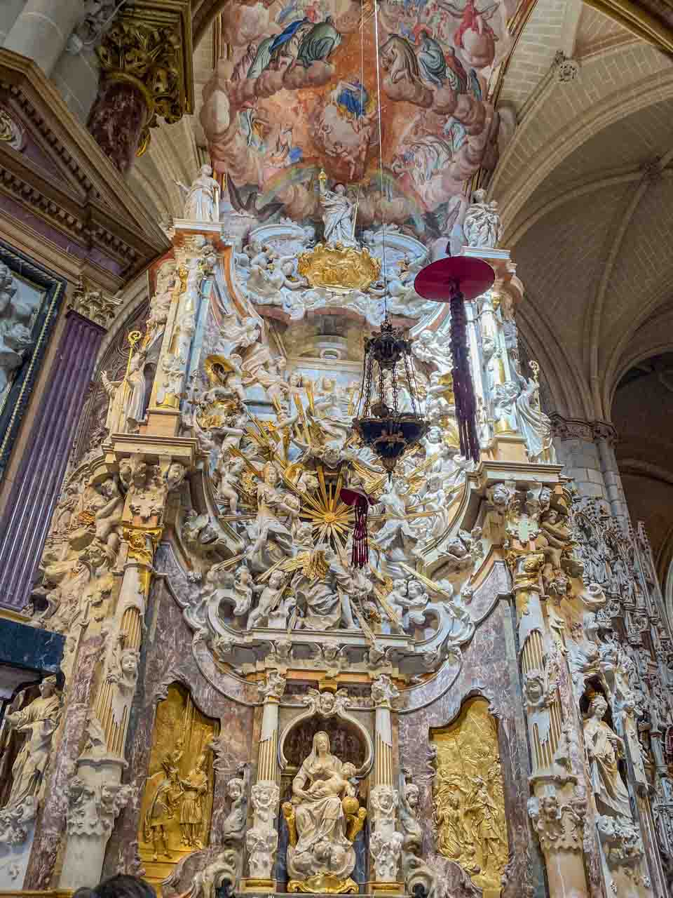 A cathedral's altar with many religious figures.