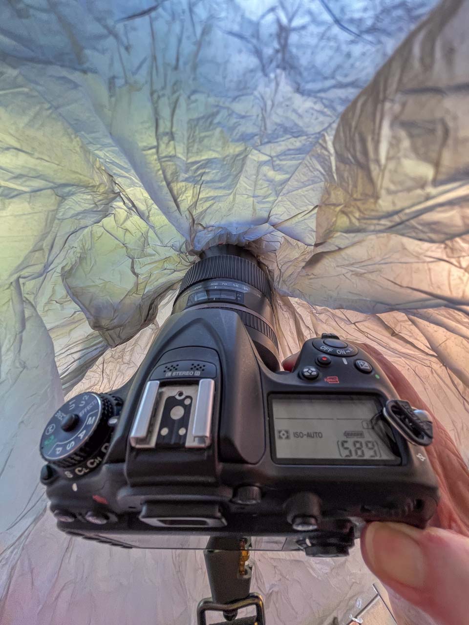 Looking through a plastic bag covering a camera.